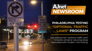 AJnet Newsroom title card showing a nighttime Philadelphia intersection filled with traffic signs and red lights beside the headline “Philadelphia Testing ‘Optional Traffic Laws’ Program.”